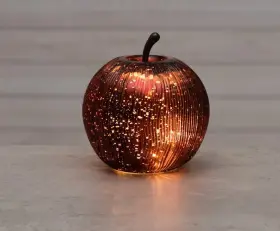 R&ouml;tt glas&auml;pple med LED-ljus