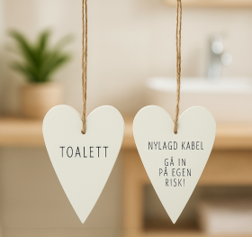 Toalettskylt -Nylagd kabel